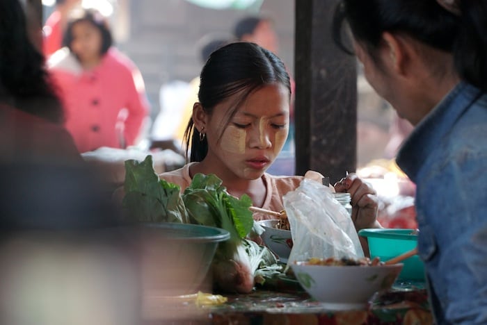 Thanakha on the cheeks of a little girl